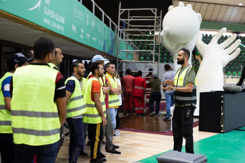 Workers preparing for event.